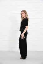 Rant & Rave Clara Trouser Black worn by model, side view, wide - leg velvet trousers with matching top