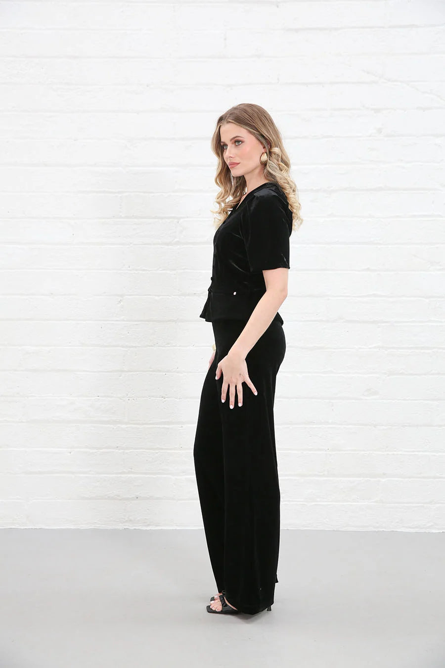Rant & Rave Clara Trouser Black worn by model, side view, wide - leg velvet trousers with matching top