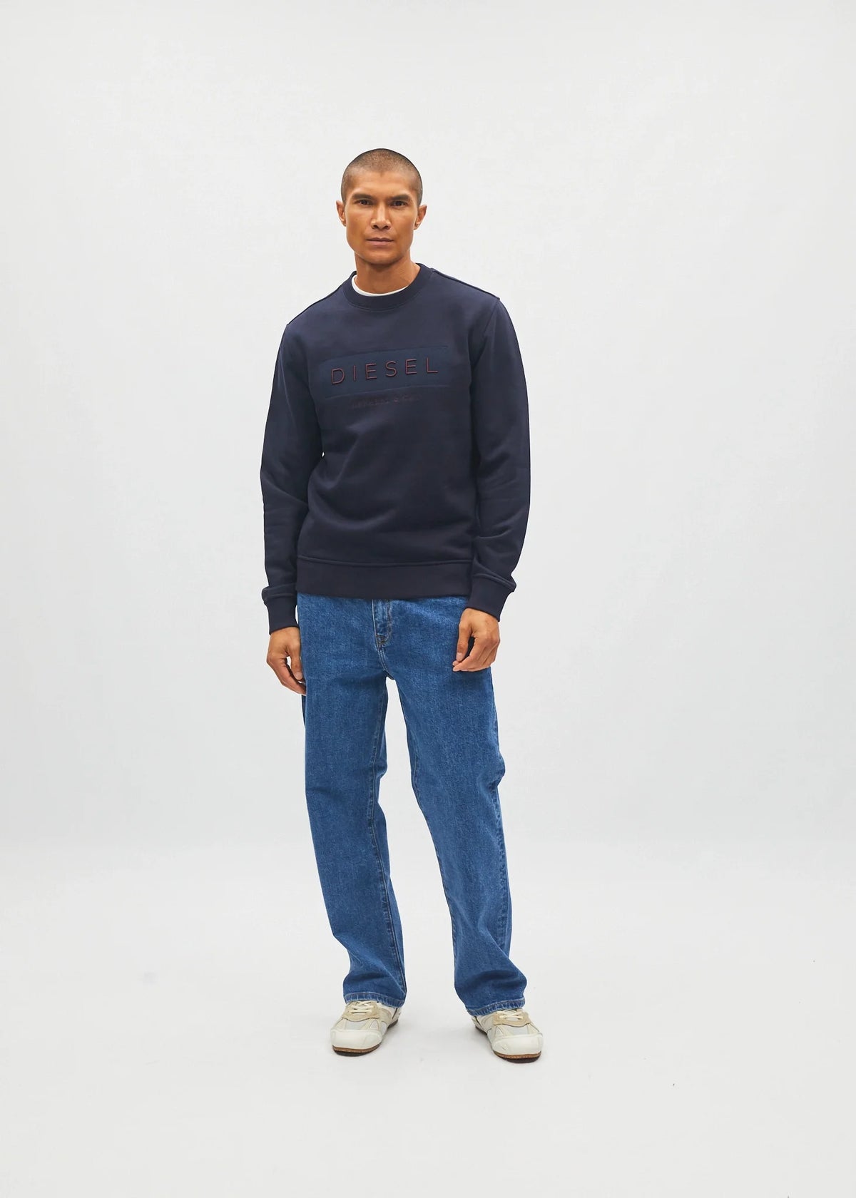 Diesel Jan Sweatshirt Metro Navy worn by model, angled front view with hands at sides