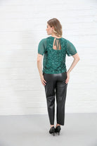 Rant & Rave Kennedy Top in green sequin back view showing tie detail worn by model