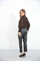 Rant & Rave Penelope Trouser Black worn by model, back view with brown lace top and heels