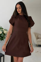 Girl In Mind ami tulip sleeve high neck mini dress in brown worn by model, angled view