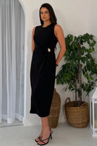 Girl In Mind Louisa black wrap detail midi dress with gold buckle, angled front model view