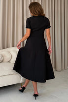 Girl In Mind Natalia beaded bow midi dress in black, back model view.