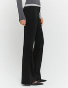 Tally Weijl Black Flare Trousers worn by model, side view