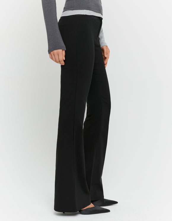 Tally Weijl Black Flare Trousers worn by model, side view