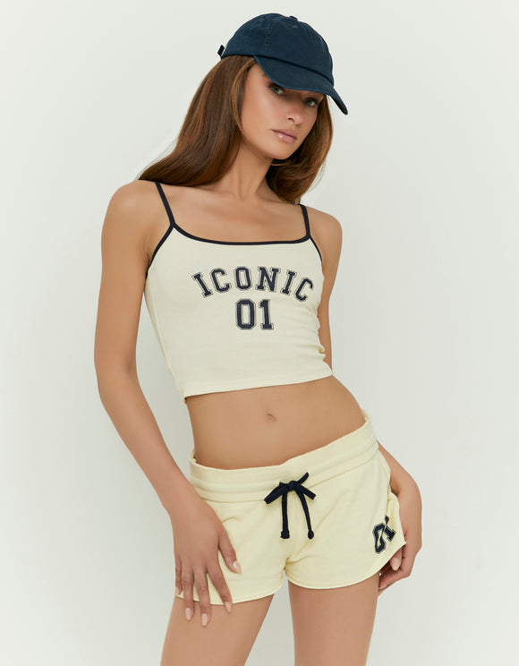 Tally Weijl yellow printed tank top worn by model, angled front view with Iconic 01 graphic