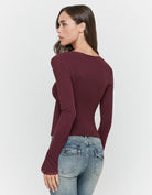 Tally Weijl Burgundy Ruched Top worn by model, back view with long sleeves