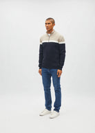 Diesel Tully Half Zip Sandshore sweater in sand, angled model view with white stripe and navy lower section.