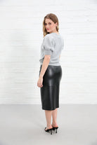 Rant & Rave Victoria Knit Top in silver, back view worn by a model, showing short puff sleeves and fitted ribbed hem.