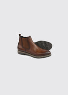 Dubarry Seth men's Chelsea boot in whiskey, one boot on its side with the treaded rubber sole visible