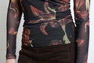 Rant & Rave Alanna Top in black, detail view of ruched hem and floral mesh fabric