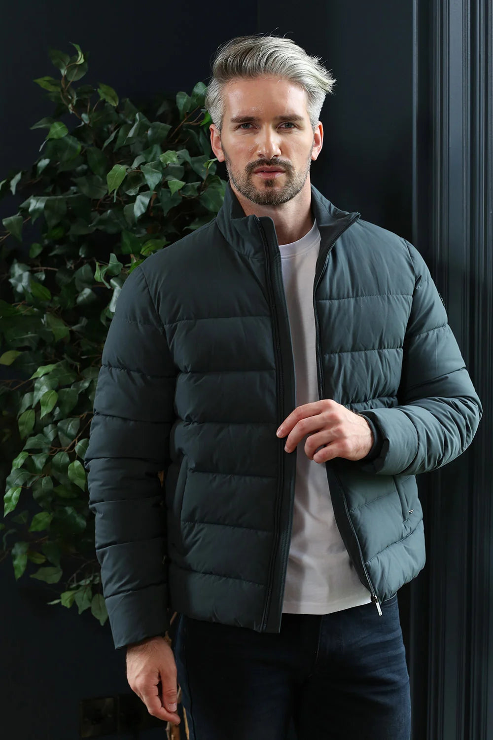 Kenrow Beck Jacket Pewter worn by model, angled view with jacket unzipped over white top
