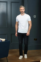 Kenrow Connor Tee in optic white worn by model, full front view with black trousers