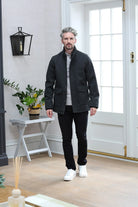 Kenrow Huxley Coat in charcoal worn by a male model, angled front view with coat open over a light grey top and black trousers.