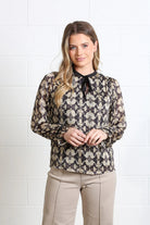 Rant & Rave Maria Top in gold, straight - on front model view with printed long sleeves