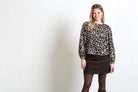 Rant & Rave Naomi Blouse in leopard, worn by model in a full front view, angled model view