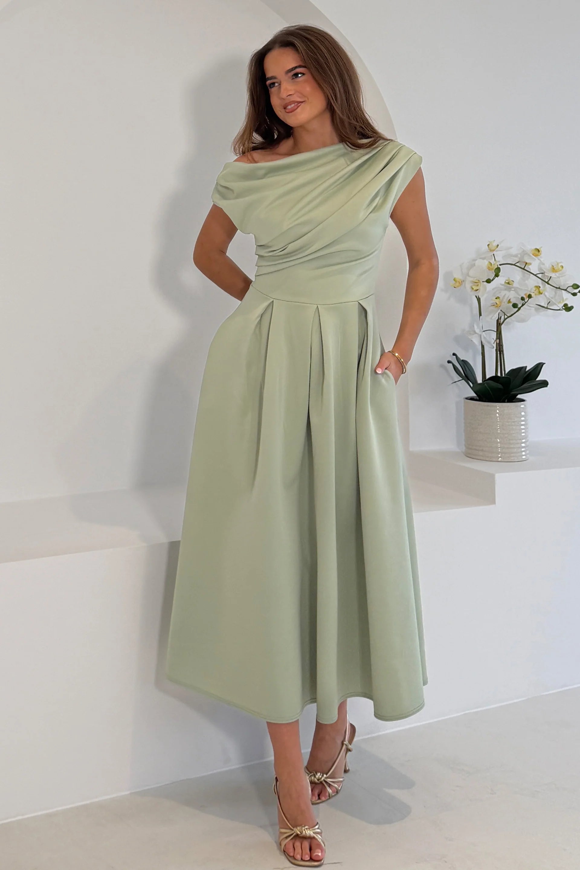 Girl In Mind Betty asymmetric neckline skater midi dress in sage, front model view with pockets