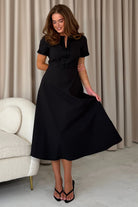 Girl In Mind Natalia beaded bow midi dress in black, front model view with flared skirt.