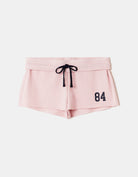 Tally Weijl pink printed shorts front view with contrast drawstring and 84 print