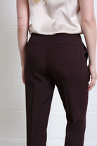 Rant & Rave Valerie Slim Trouser in aubergine, close back detail view showing waistband and welt pockets