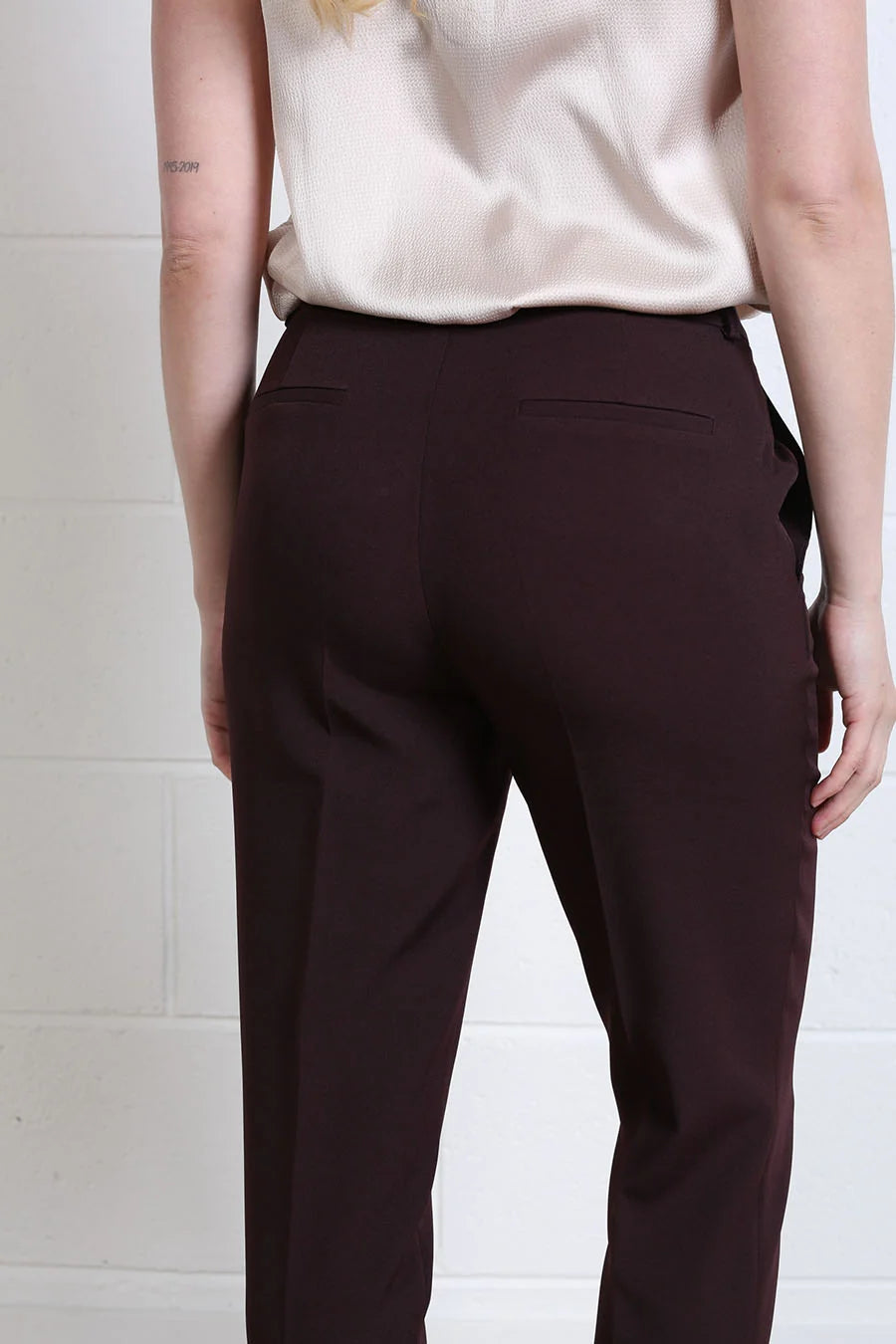 Rant & Rave Valerie Slim Trouser in aubergine, close back detail view showing waistband and welt pockets