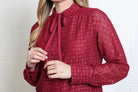 Rant & Rave Vivian Shirt in burgundy, detail view of the pussybow neck tie and lace texture