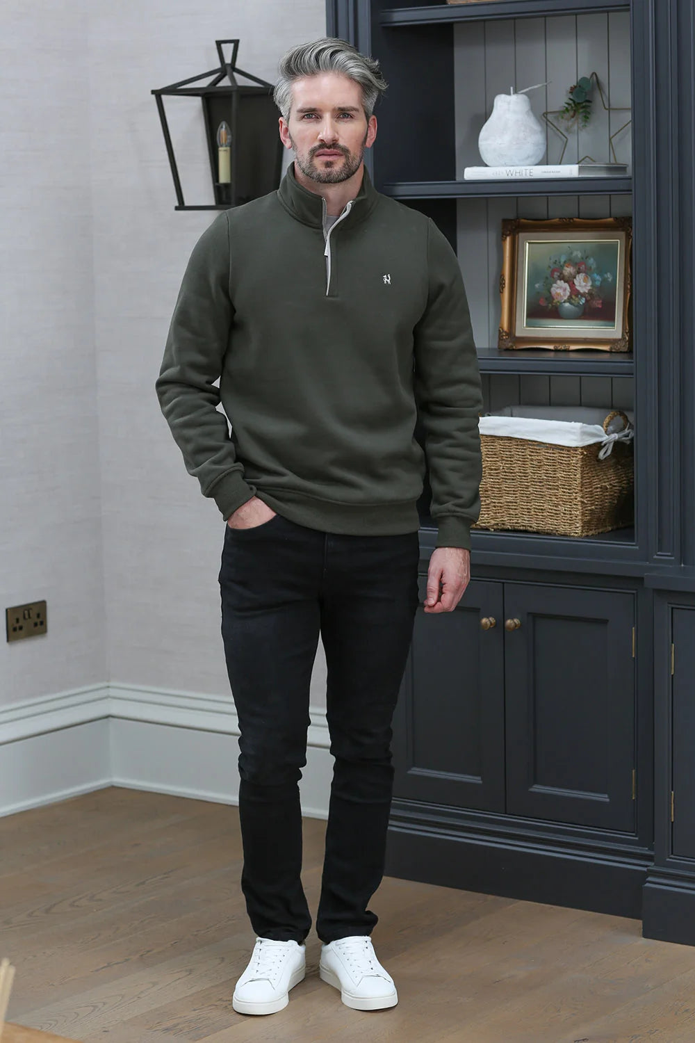 Kenrow Wesley Half Khaki quarter-zip sweater in khaki, model standing in room