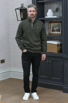 Kenrow Wesley Half Khaki quarter-zip sweater in khaki, model standing in room