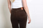 Close - up detail of the back pockets and waistband on the Rant & Rave Bridget Cord Wide Leg mocha trousers.