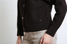 Rant & Rave Claire Cardigan in dark brown, detail view of fabric and side seam