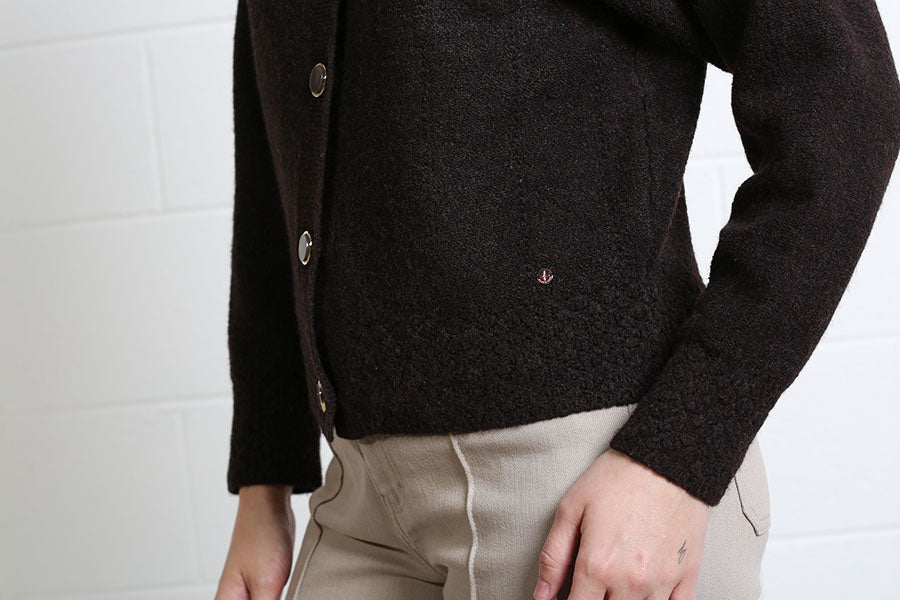Rant & Rave Claire Cardigan in dark brown, detail view of fabric and side seam