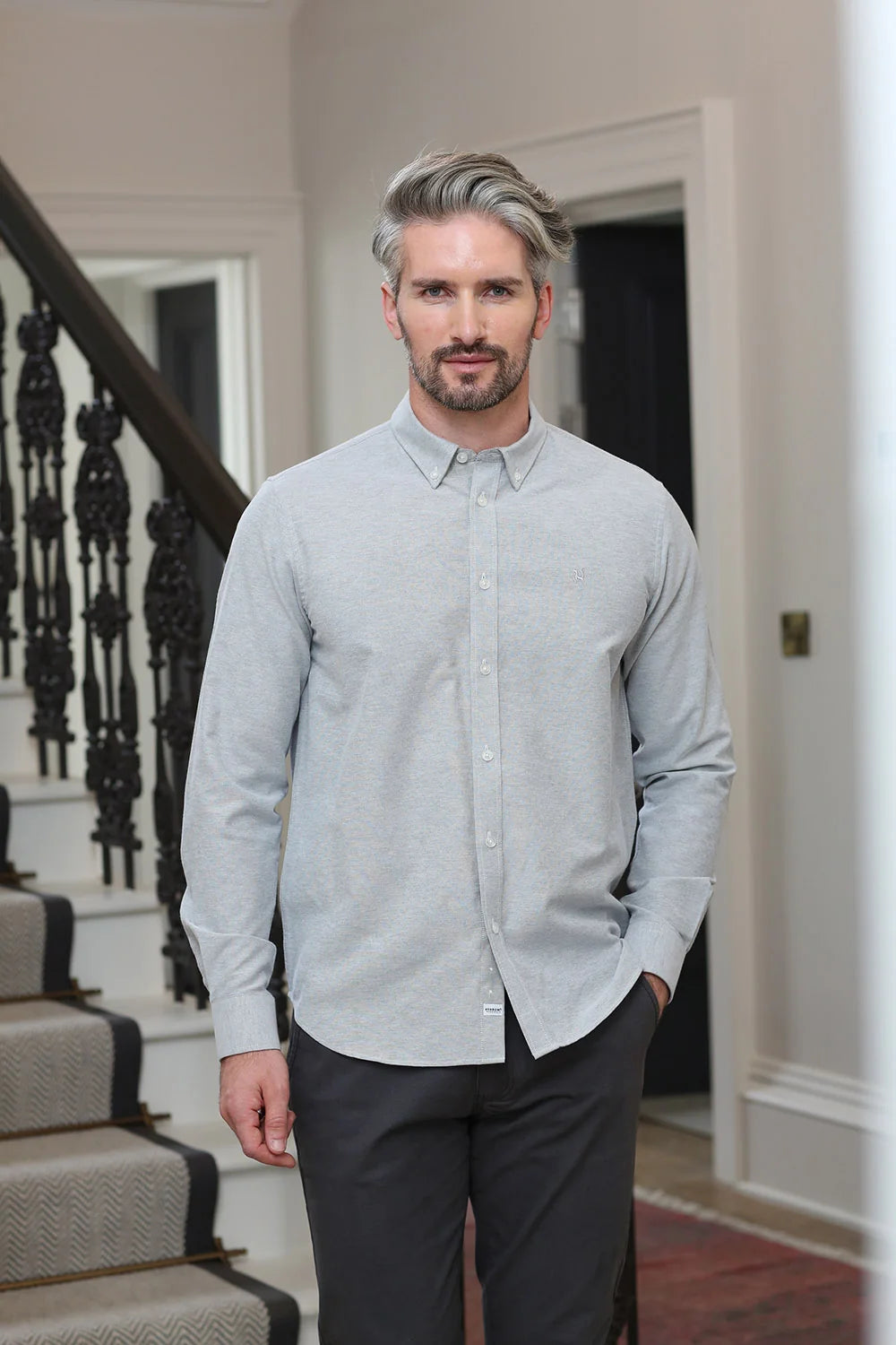 Kenrow Fritz Shirt in light grey worn by model, front view with hand in pocket.