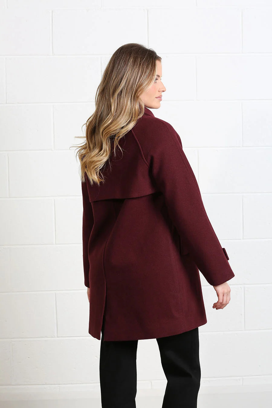 Rant & Rave Georgia Coat in deep port worn by model, angled back view with storm flap and vent