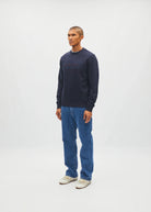 Diesel Jan Sweatshirt Metro Navy worn by model, side model view showing sleeve and ribbed hem