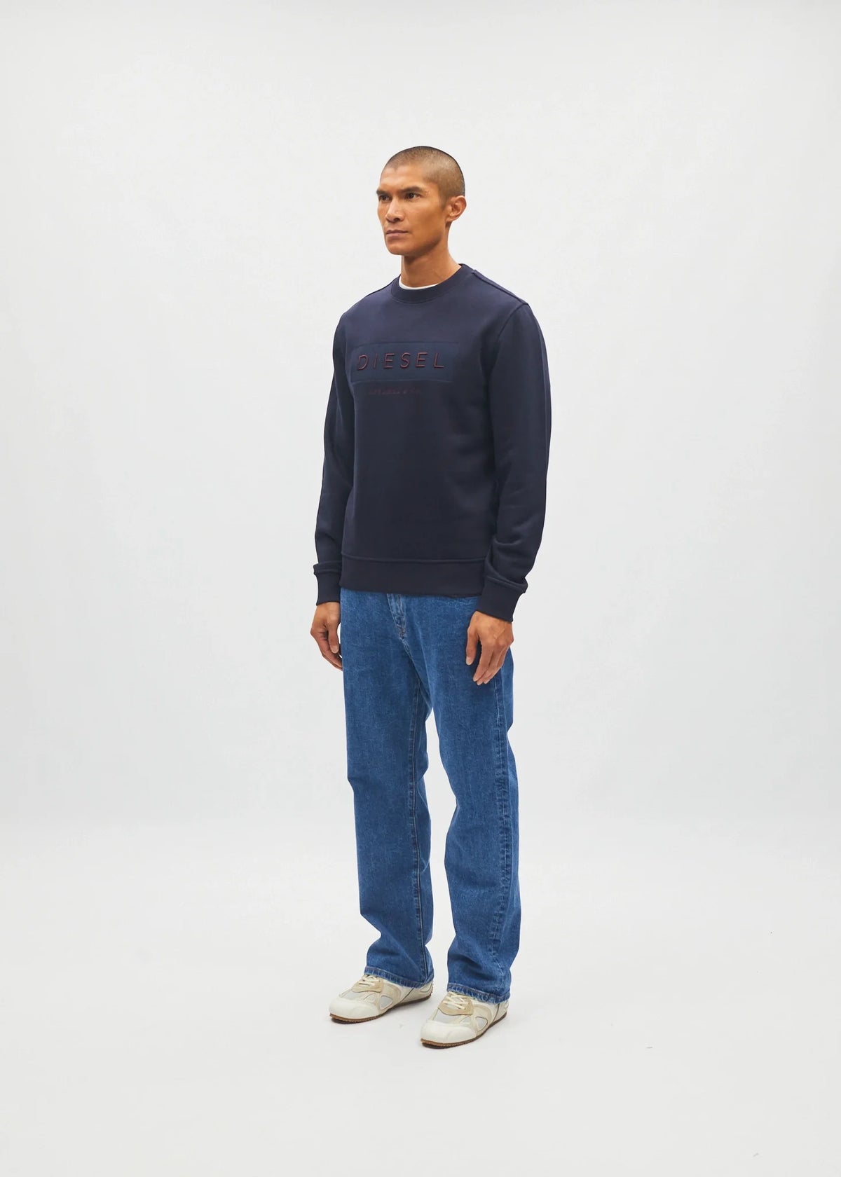 Diesel Jan Sweatshirt Metro Navy worn by model, side model view showing sleeve and ribbed hem
