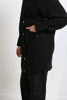 Rant & Rave Joanna Coat in black, detail view of pocket and snap front