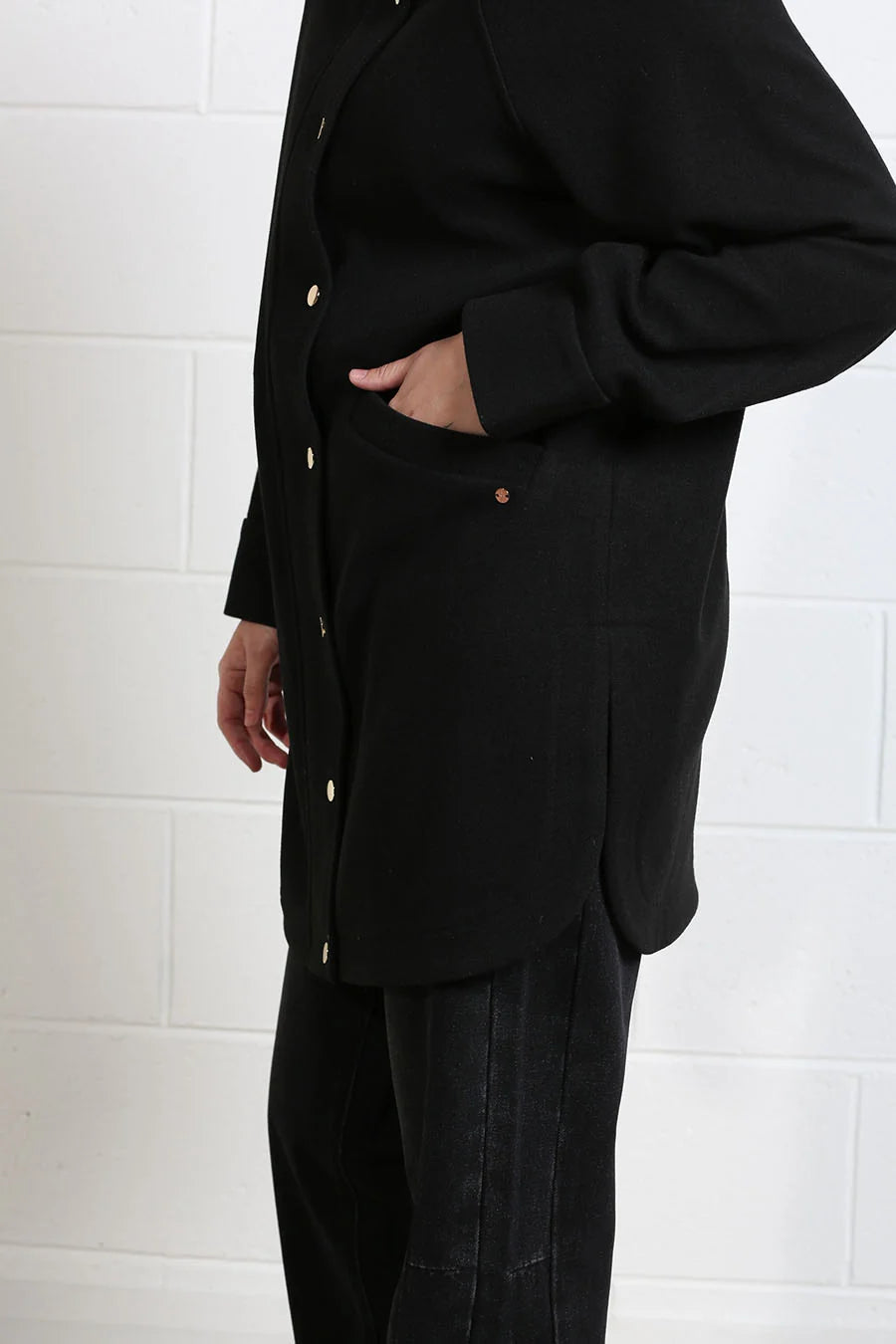 Rant & Rave Joanna Coat in black, detail view of pocket and snap front
