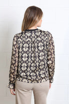 Rant & Rave Maria Top in gold, back view showing all - over print and long sleeves