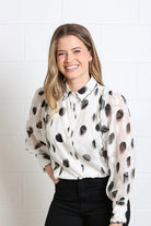 Rant & Rave Posy blouse in white, close model view with black spot print and button front.