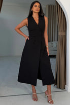 Girl In Mind Hazel tailored sleeveless midi dress in black, angled model view