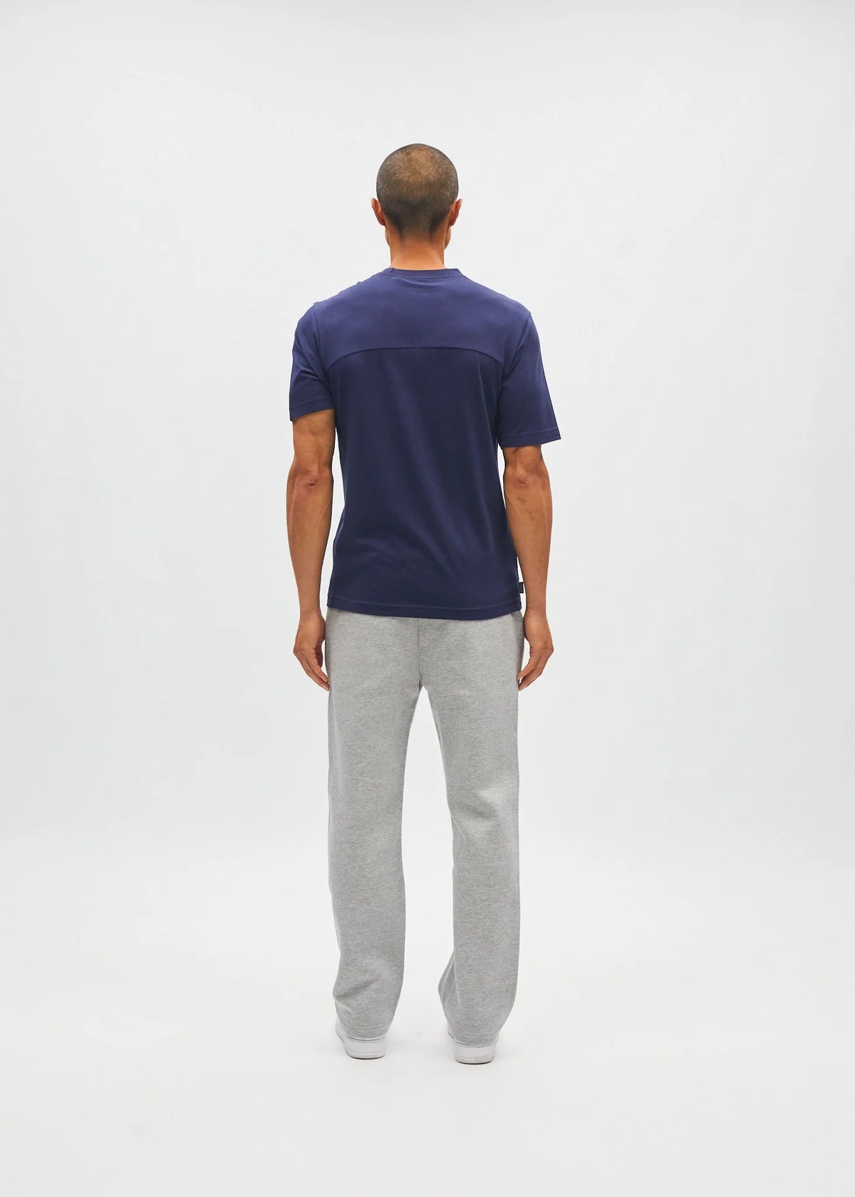 Diesel Walter Tee in navy worn by a model, back view showing the plain rear panel and short sleeves.