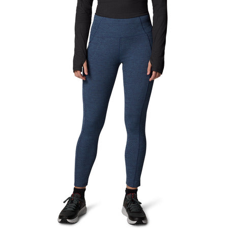 Blue leggings worn by a person on a white background