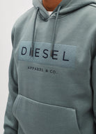 Detail view of the Diesel Jameson Hoodie in Green Meadow showing the embroidered chest logo and drawstrings.
