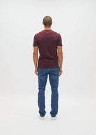 Diesel John Tee in deep burgundy worn by a model, back view