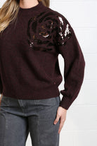 Detail view of Rant & Rave Sarah Jumper in burgundy with sequin rose embroidery on shoulder