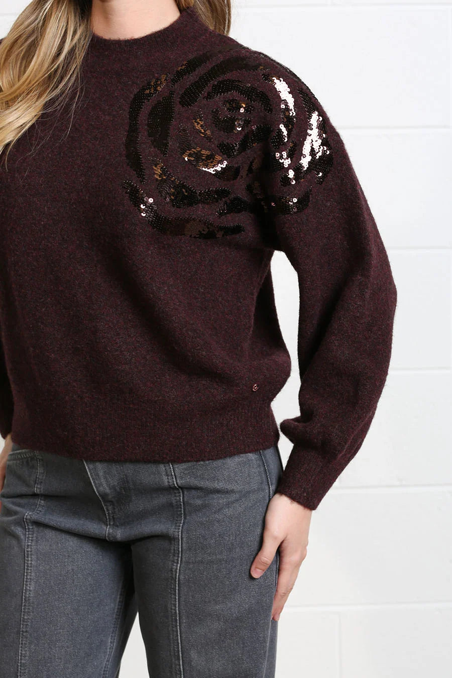 Detail view of Rant & Rave Sarah Jumper in burgundy with sequin rose embroidery on shoulder