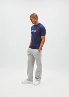Diesel Walter Tee in navy worn by a model, side view with white Diesel logo across the chest.