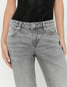 Detail of Tally Weijl grey low waist straight leg jeans front waistband and pockets