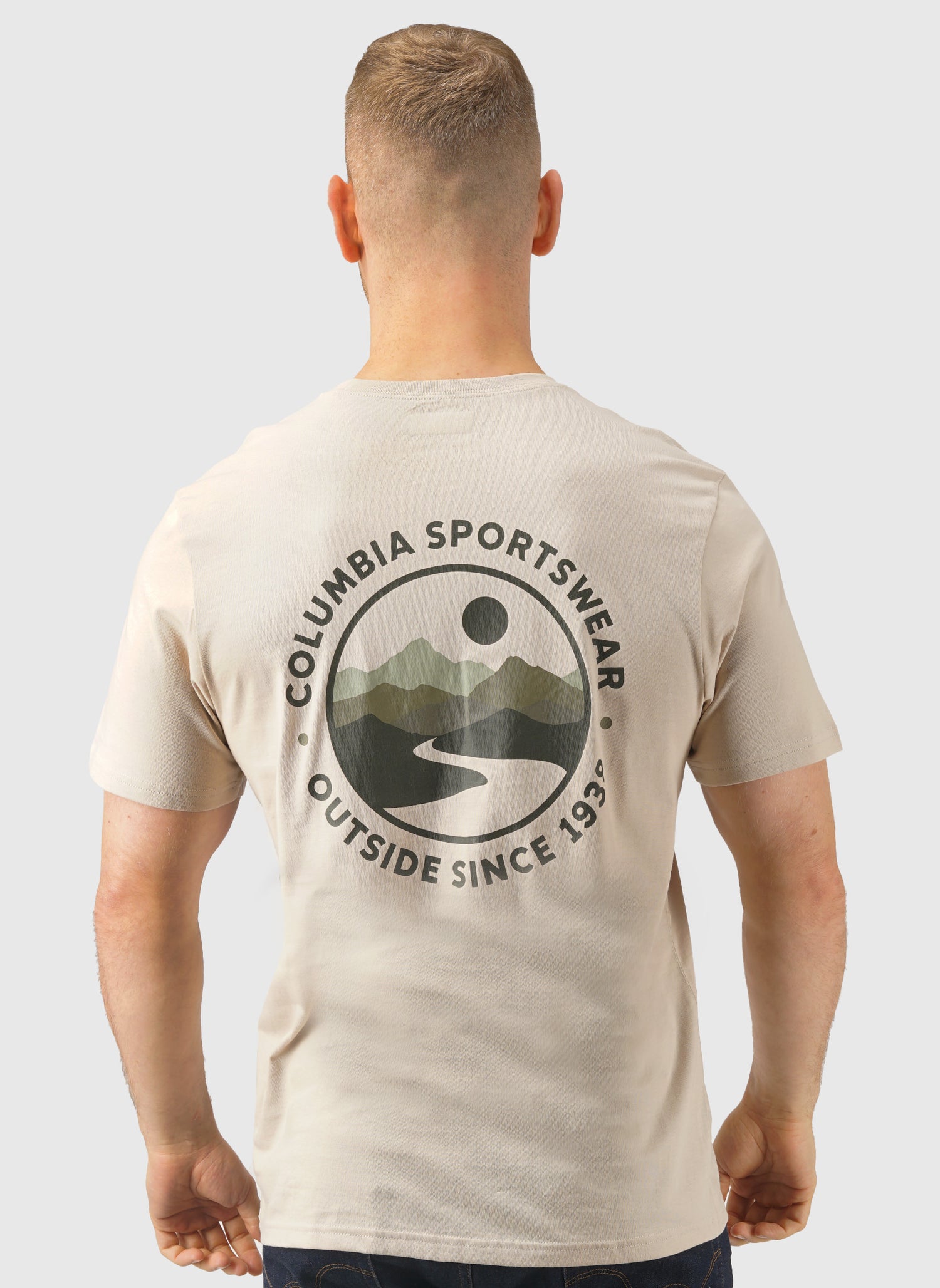 Man wearing a beige Columbia Sportswear t-shirt with a logo on the back against a white background